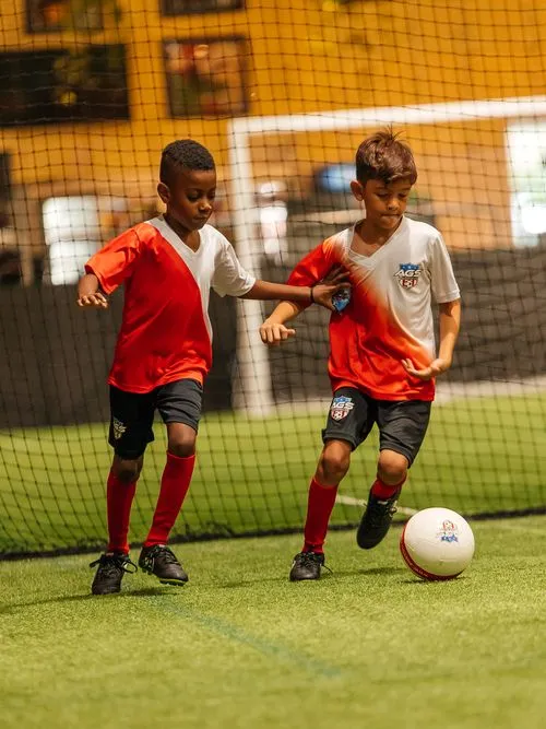 A soccer team of 4 year olds playing fun pickup drills. 4 Year Olds Playing Soccer at Day Camp