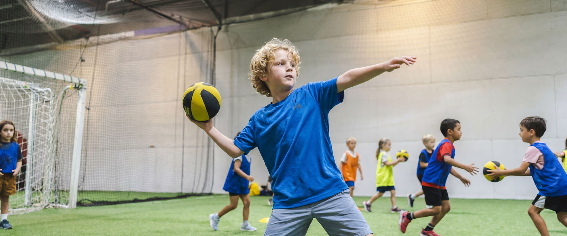 Kids celebrating at an indoor soccer birthday party at AGS Youth Soccer in Fort Lauderdale, Florida
