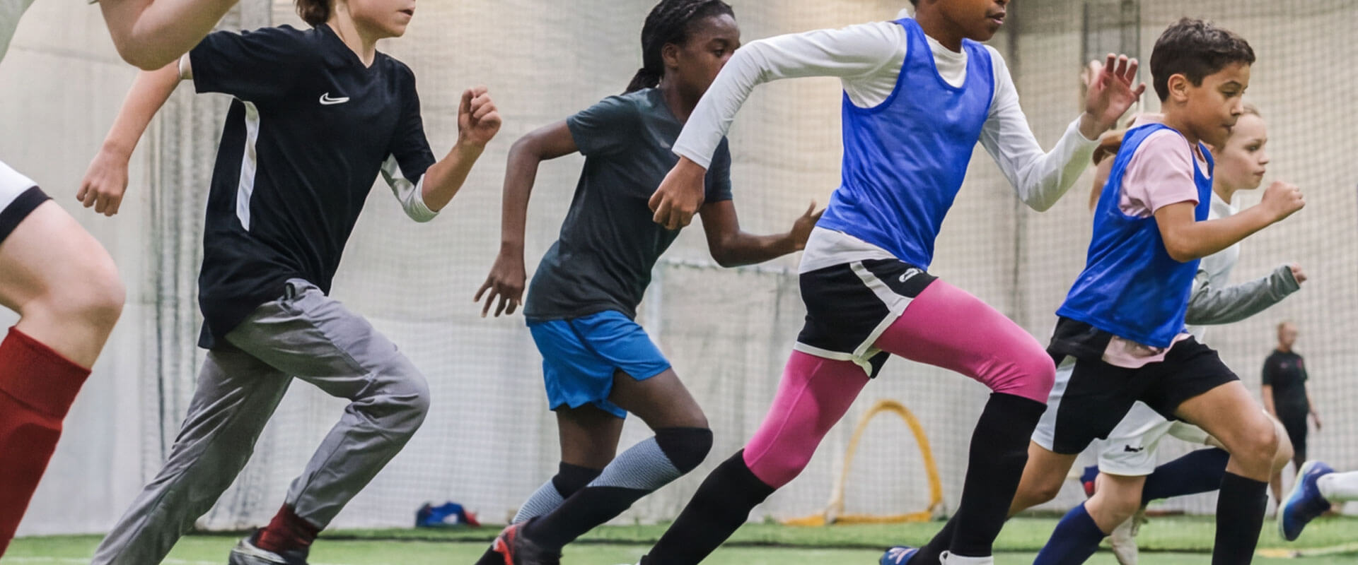 Kids participating in indoor youth soccer training at AGS Youth Soccer in Fort Lauderdale